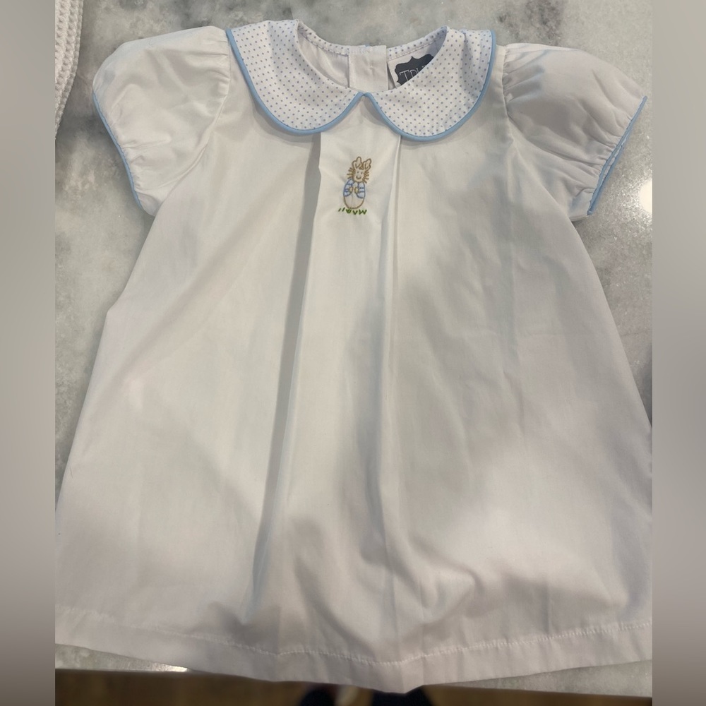 Beautiful girls dress with bunny stitching. Worn twice. No stains. 2T
